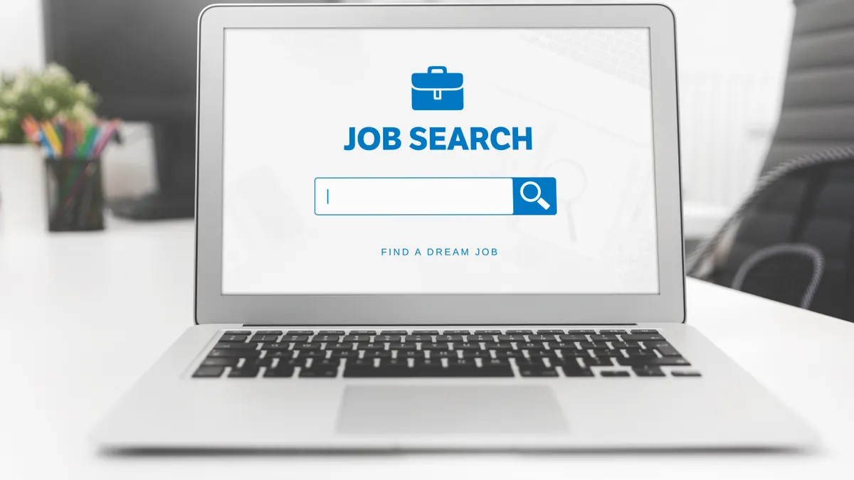 Job search application on laptop screen.