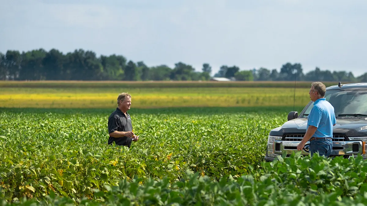 President of Benson Hill Seeds, Jeff Johnson, and one of our farmer partners on a soybean farm
