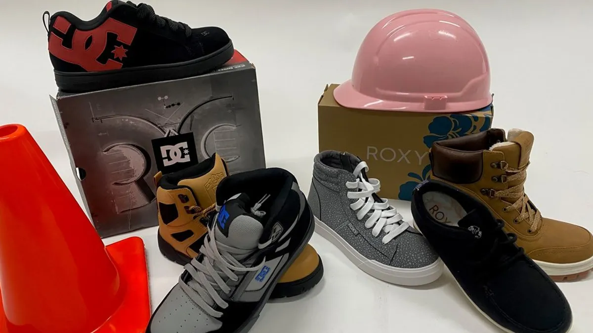 A group of shoes from DC Shoes and Roxy are pictured on display.