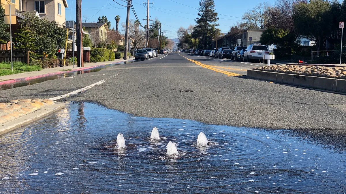 Water bubbles up from a road