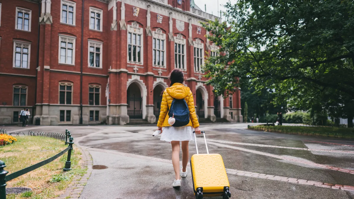 Exchange student with suitcase just arriving to study in Krakow