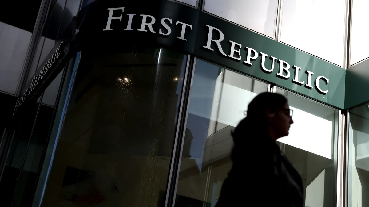 A person walks by a First Republic Bank branch.