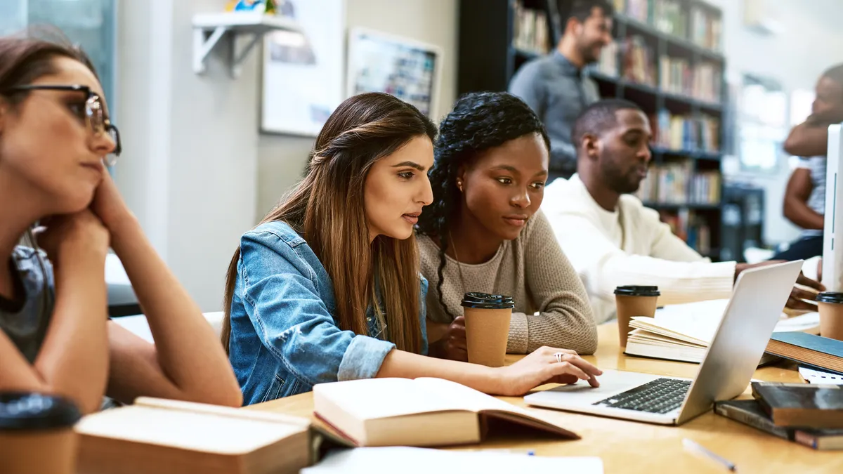 Female college students using a computer