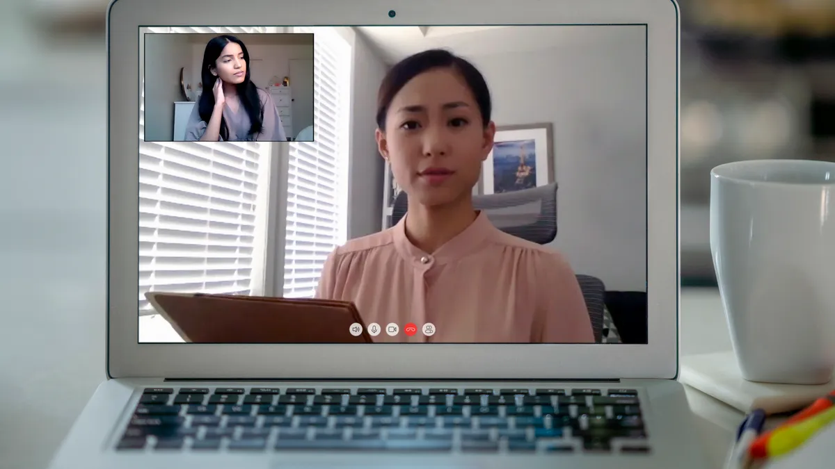 A person video calls with a counselor.