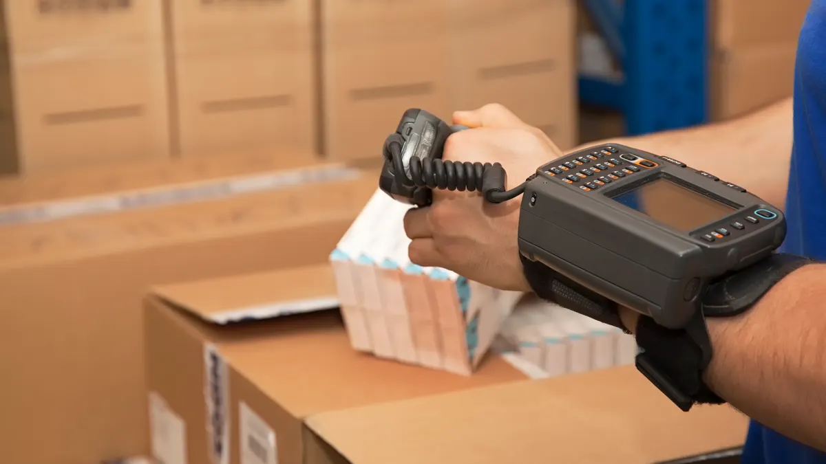 Cargo man checking on digital equipment