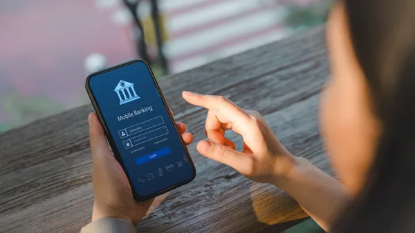 A customer accesses a banking app on their phone.