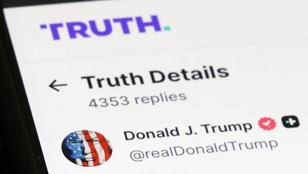 A phone shows U.S. President Donald Trump's Truth Social account on December 15, 2025 in Washington, DC.