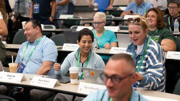 Students talk and laugh in a classroom setting
