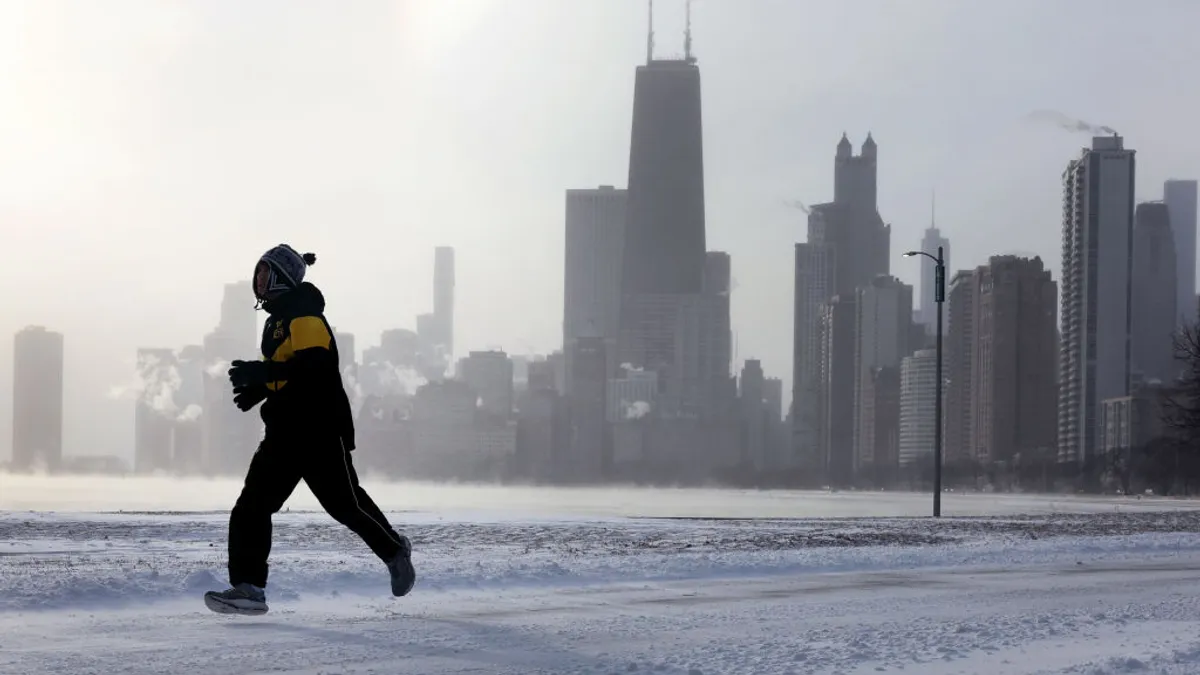 A jogger runs along Lake Michigan on December 22, 2022 in Chicago, Illinois.