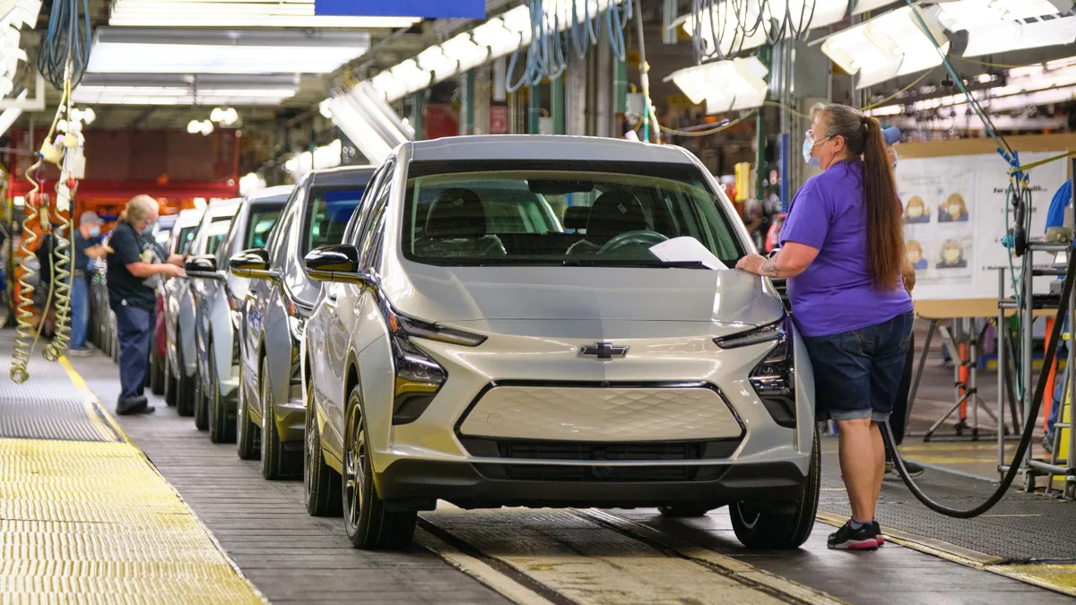 Employees assemble Chevrolet Bolt EUVs.