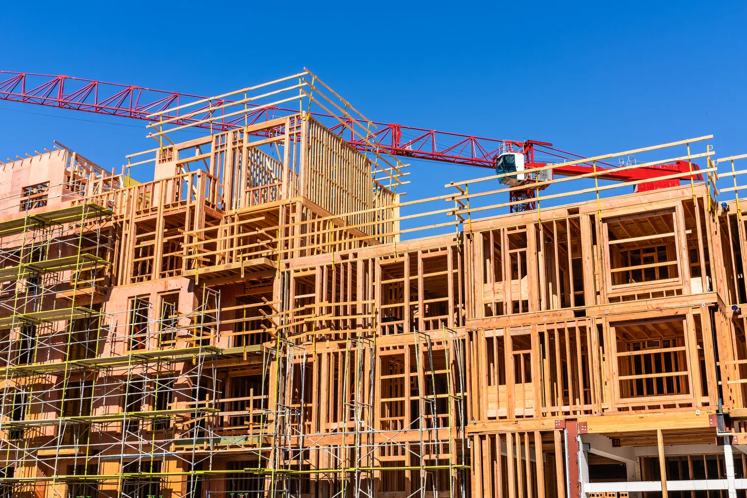 Exterior view of multifamily residential building under construction.