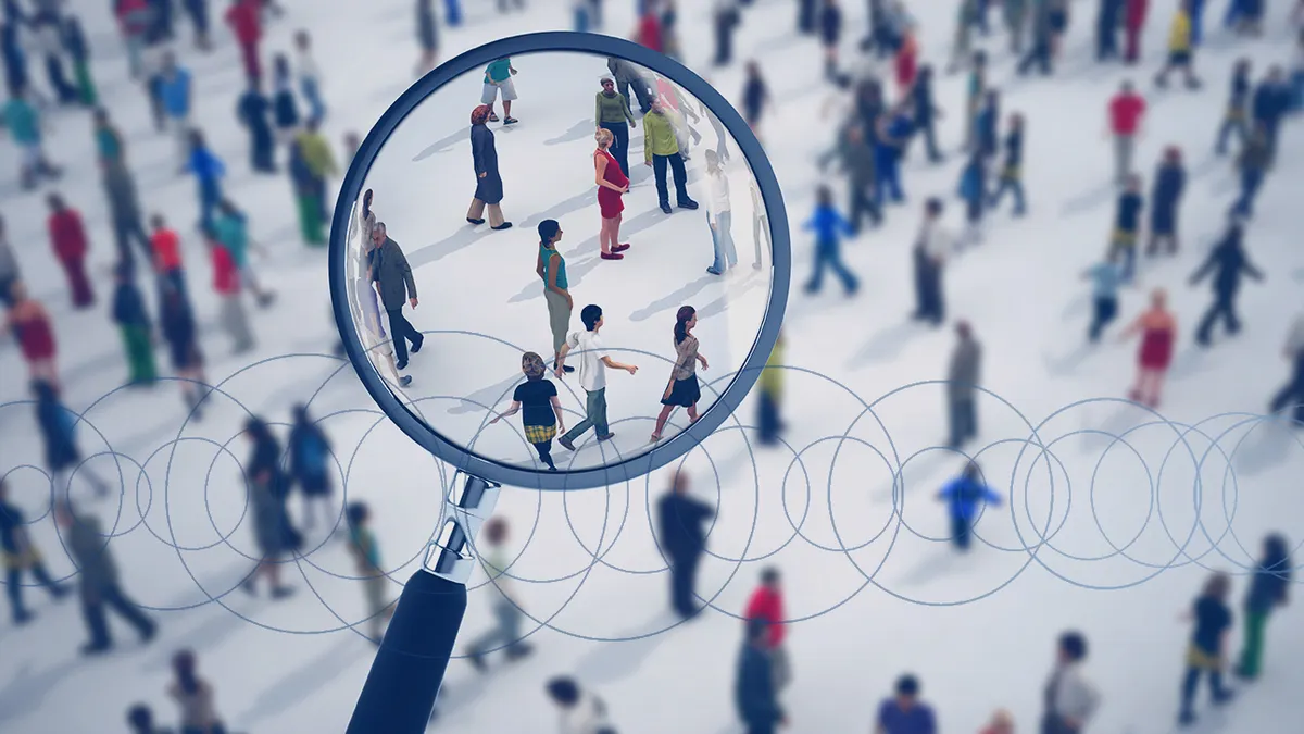Blurred illustration of crowd with a magnifying glass clear on small group of people