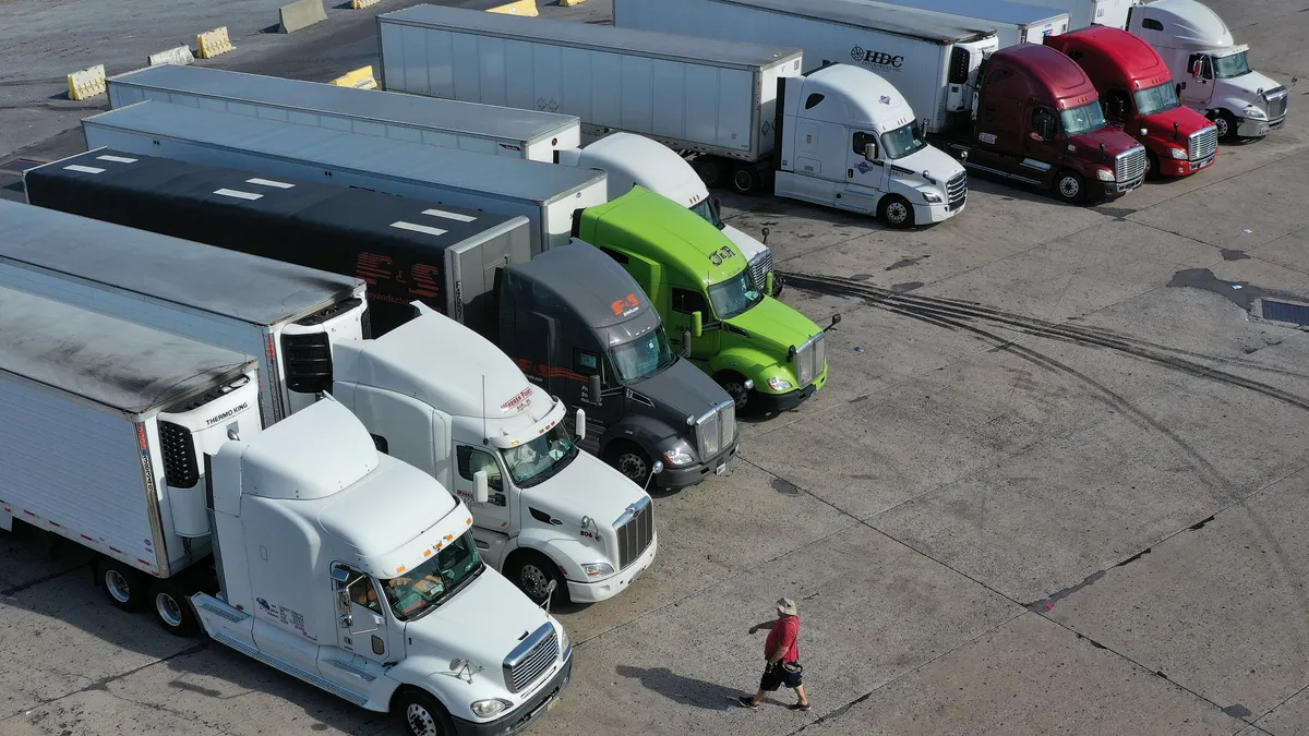 Trucks park at the Flying J Truck Stop near the interchange of Interstates 70, the Pennsylvania Turnpike and U.S. Route 30 on October 14, 2021 in Breezewood, Pennsylvania.