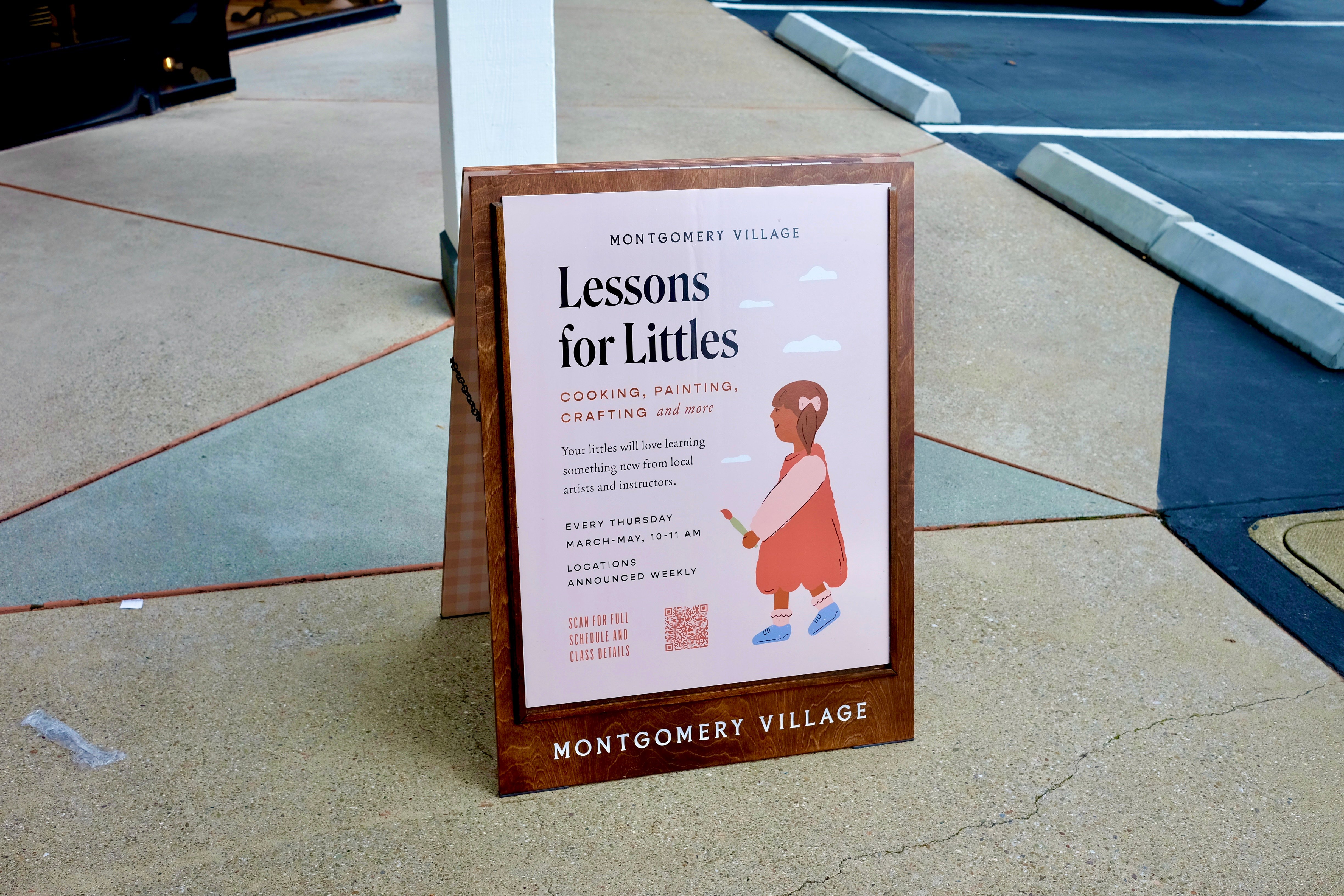 A sign says "Lessons for Littles," with a drawing of a child holding a paintbrush.