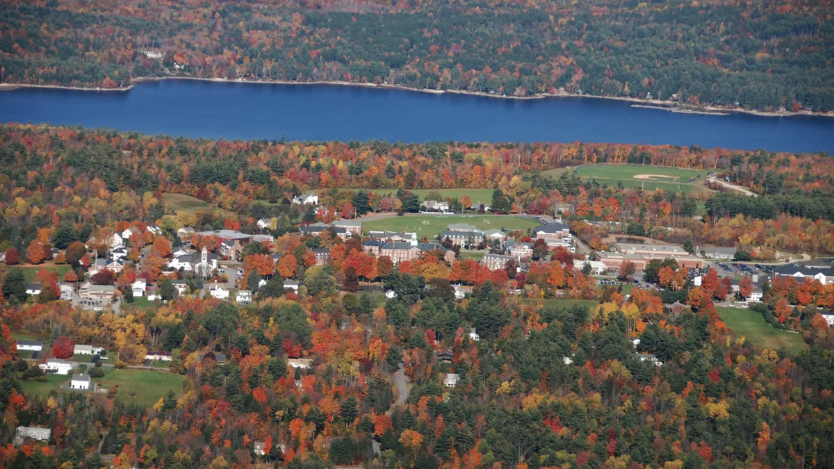 An aerial shot looks at Colby-Sawyer College's campus, surrounded by colorful leaves.