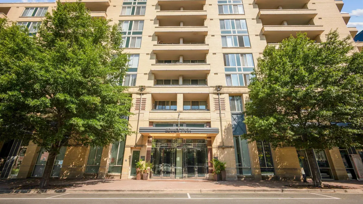 Ground view of brick high-rise apartment building