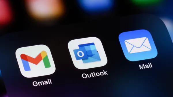 Gmail, Outlook and Apple's mail apps are pictured on a smartphone screen.