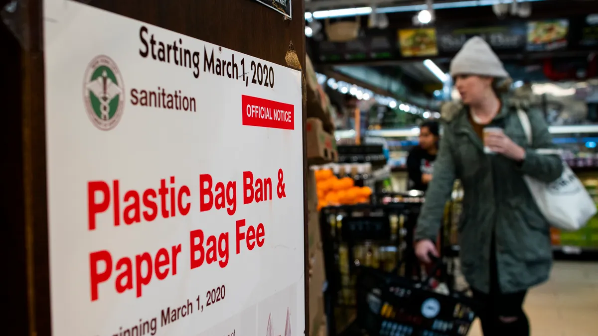 A customer carries her own reusable bag as she goes shopping at a local supermarket on March 1, 2020, in New York City.