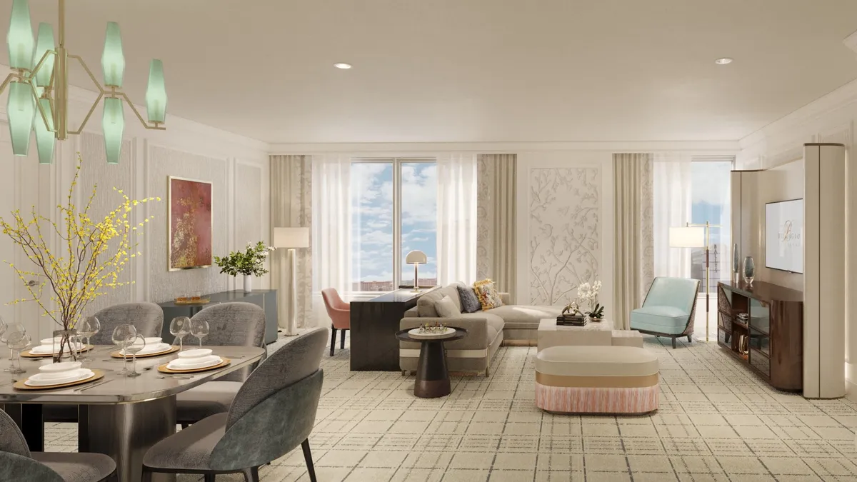 Rendering of a suite in Bellagio’s Spa Tower, including a set dining table, desk, couch and living area in front of windows.