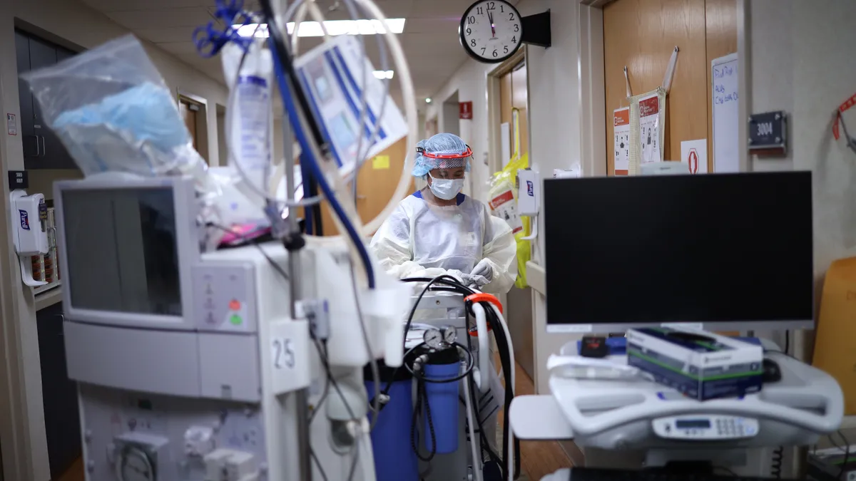 A member of the dialysis prepares to treat a patient at a hospital in Maryland.