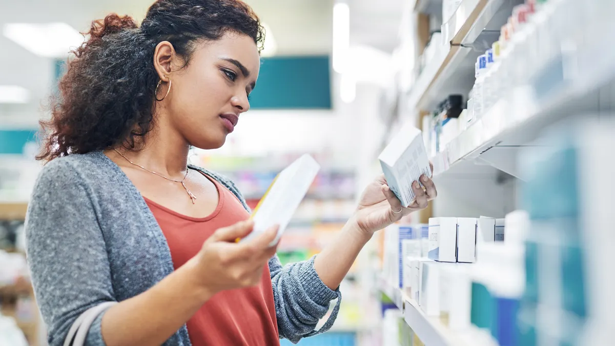 Woman browsing medicine in a pharmacy