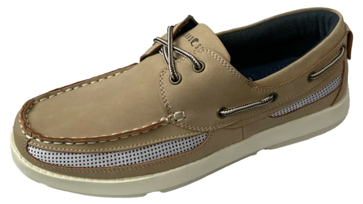 A tan boat shoe is silhouetted against a white background.