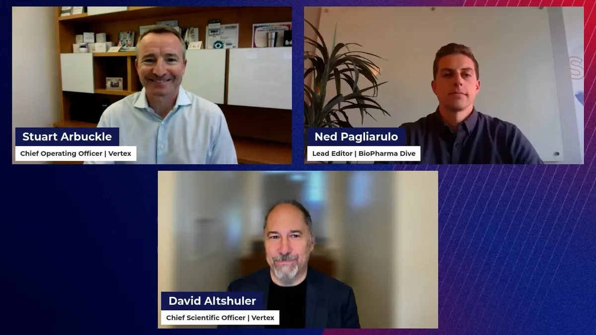 A still image of a reporter speaking with two executives in an virtual panel discussion.