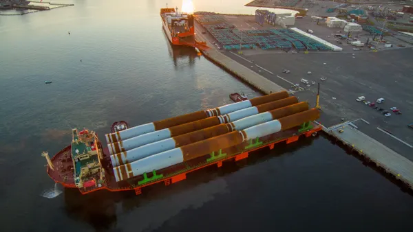 A large cargo ship with monopile foundations