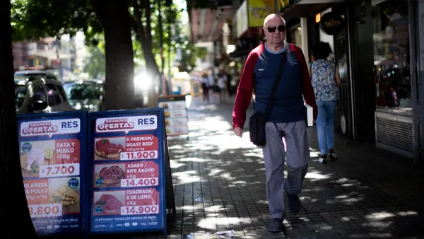 Fiserv Argentina payments processing currency inflation