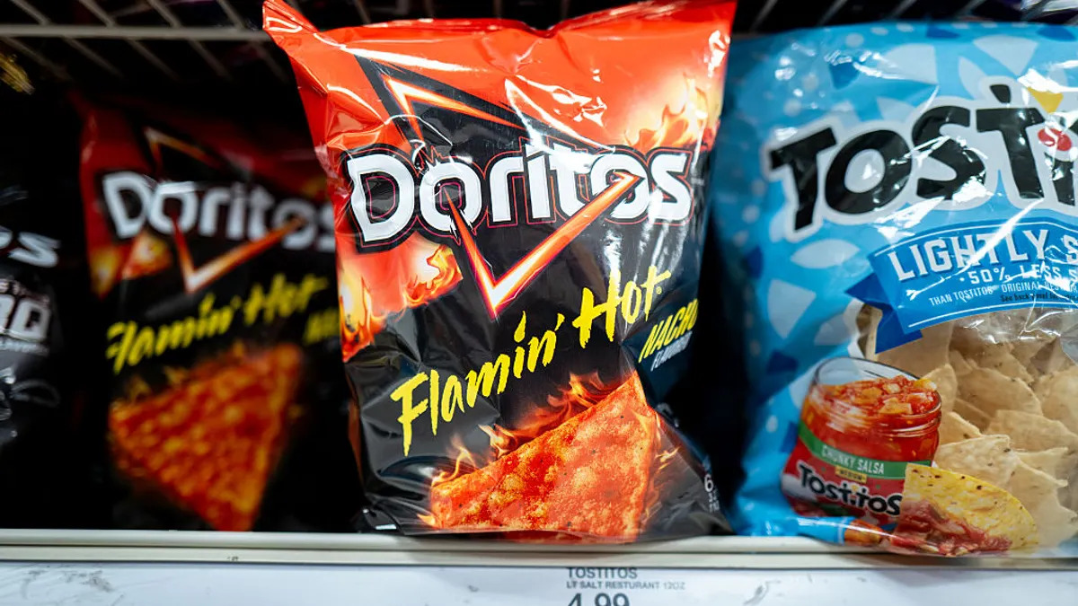 Bags of Doritos sit on shelves