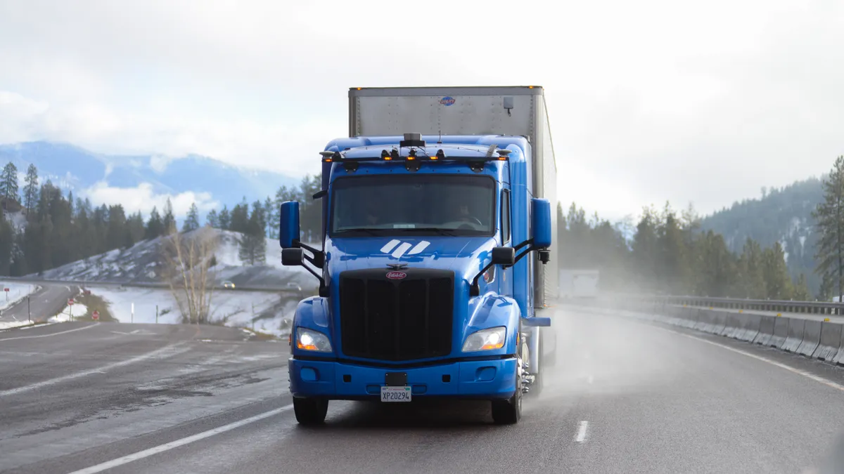 A picture of a truck with autonomous capabilities being tested in snowy Montana conditions.