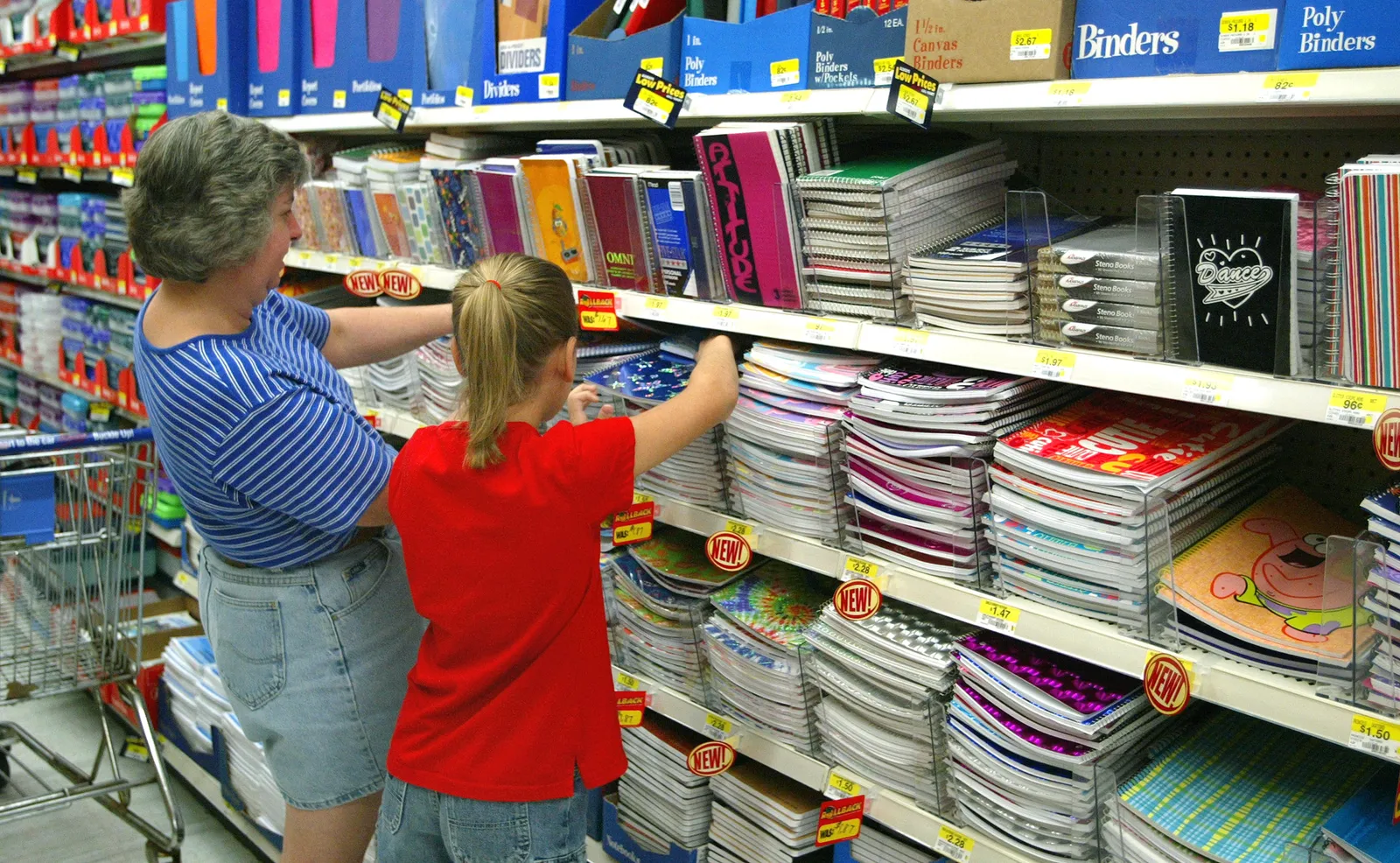 Adult and child shopping for school supplies