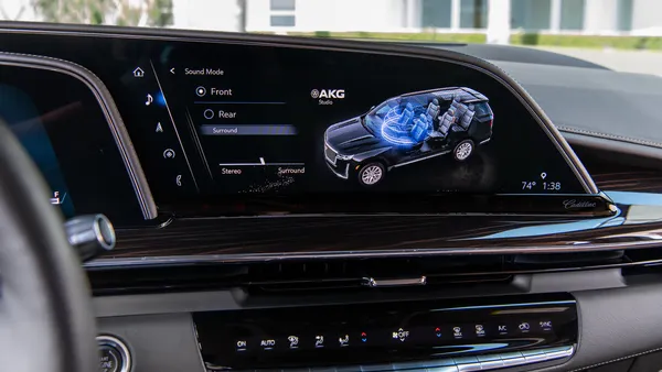 The OLED display in a 2021 Escalade with an infotainment screen displaying controls for audio setting