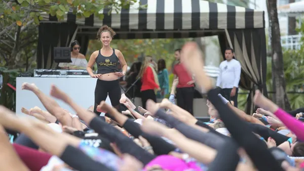 A yoga instructor leading a yoga class