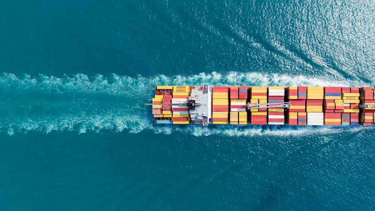 Shipping container boat sailing in the ocean