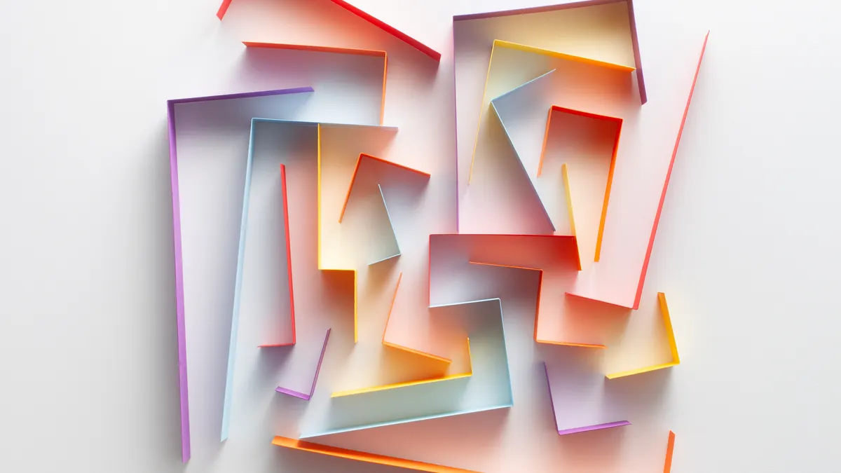 Orange strips of paper forming a maze