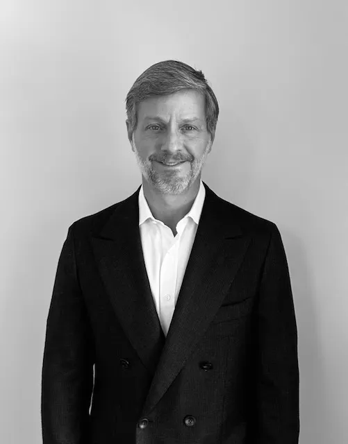 A black and white portrait of a person.