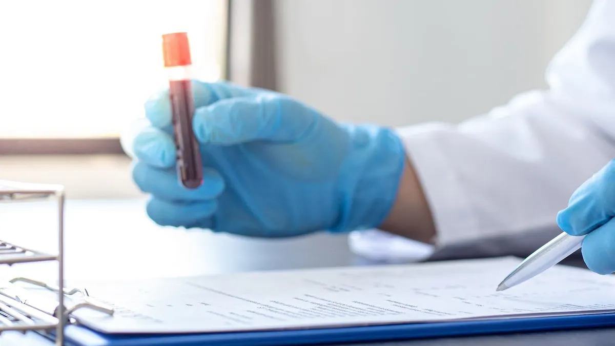 Medical professional working in a lab review samples
