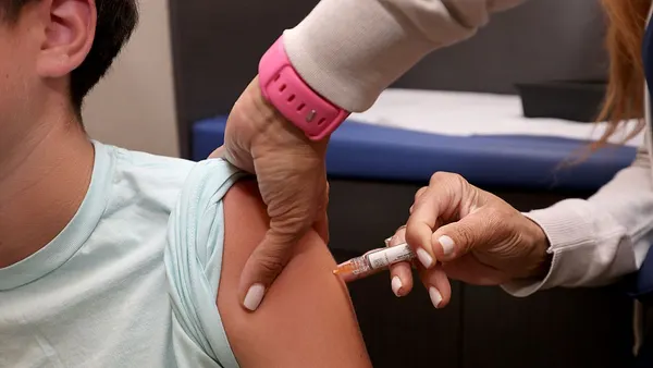 A child receives a standard immunization at Dr. Gary Kramer's pediatric office on September 15, 2025, in Coral Gables, Florida.