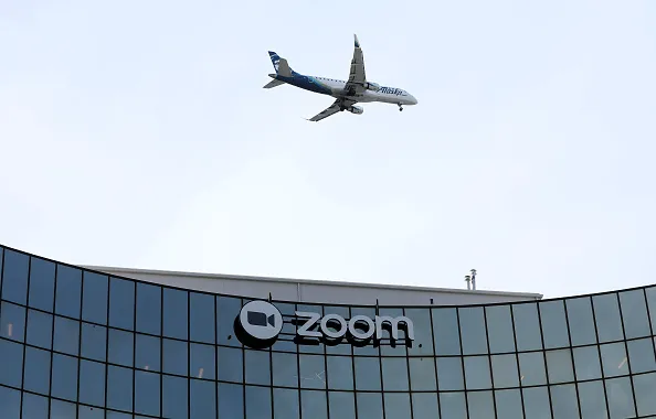 A sign is posted on the exterior of Zoom headquarters on February 07, 2023 in San Jose, California.