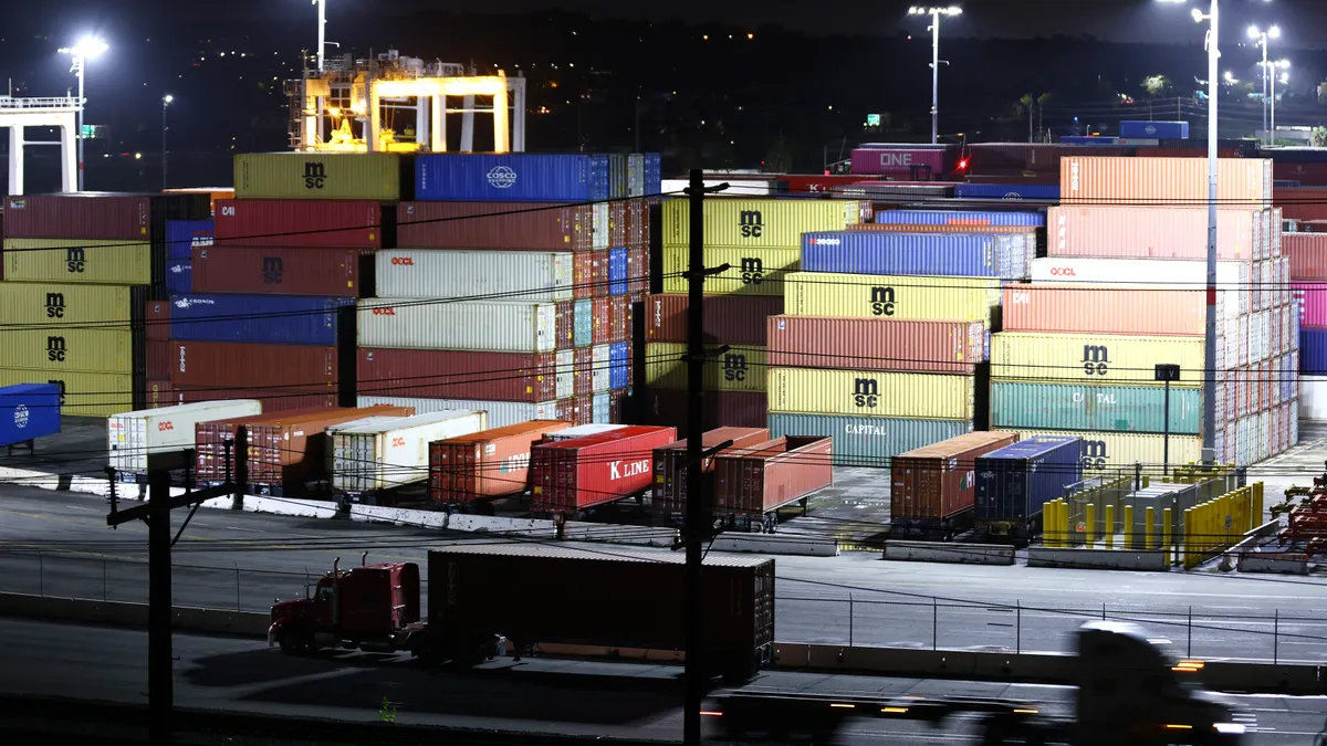 Containers wait to be picked up by trucks at the Port of Los Angeles.