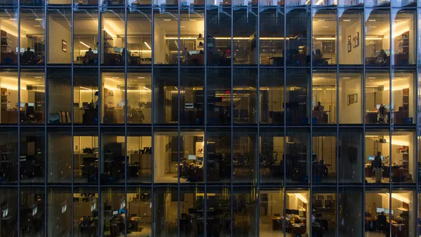 Office space behind glass curtain wall