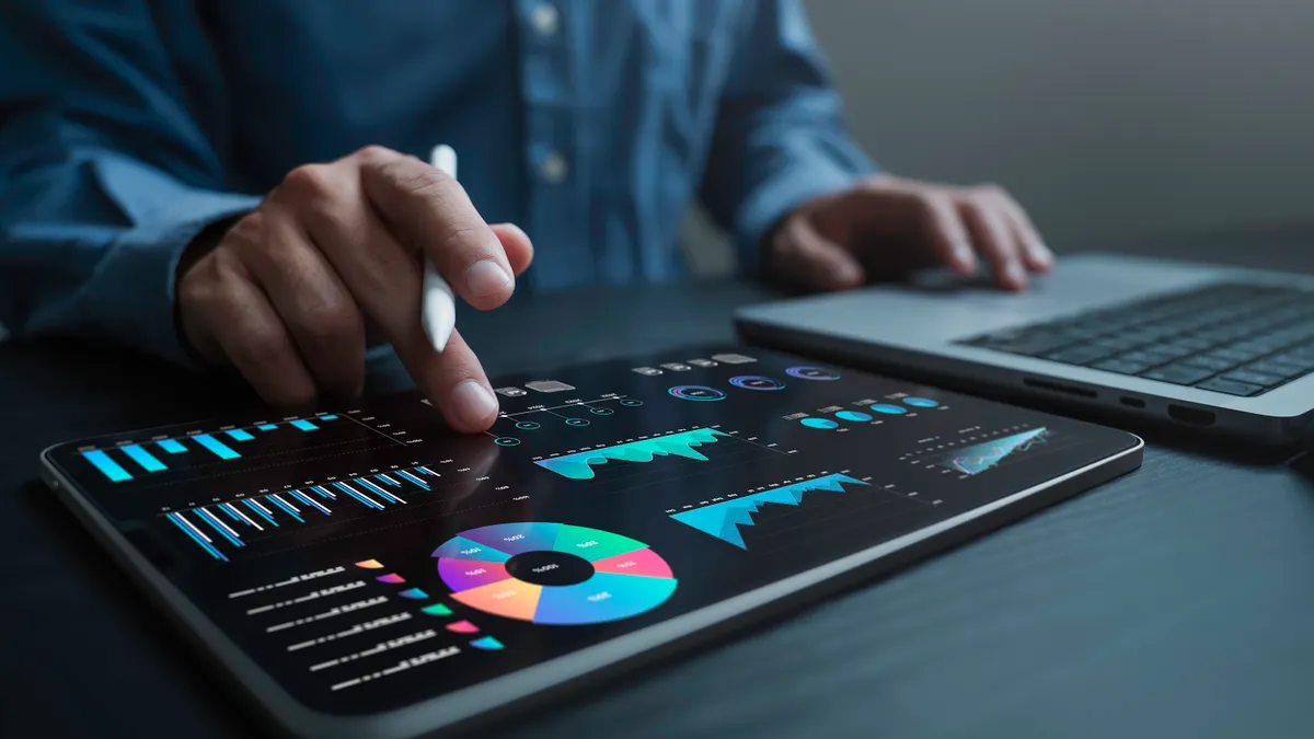 An analyst uses a computer and dashboard for data business analysis and Data Management System with KPI and metrics connected to the database for technology finance, operations, sales and marketing.