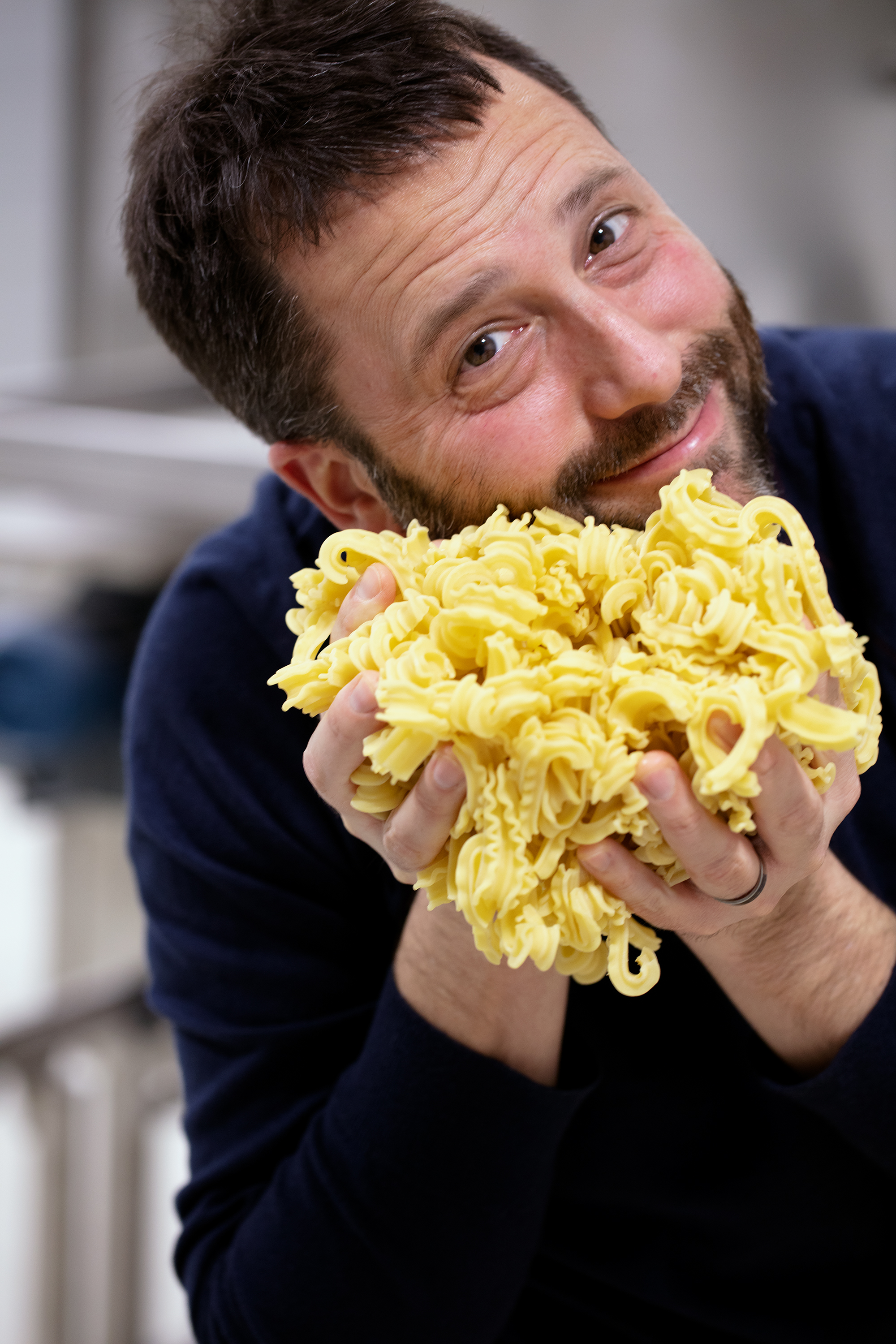 A picture of Dan Pashman holding a batch of Cascatelli by Sporkful, taken by Scott Gordon Bleicher.