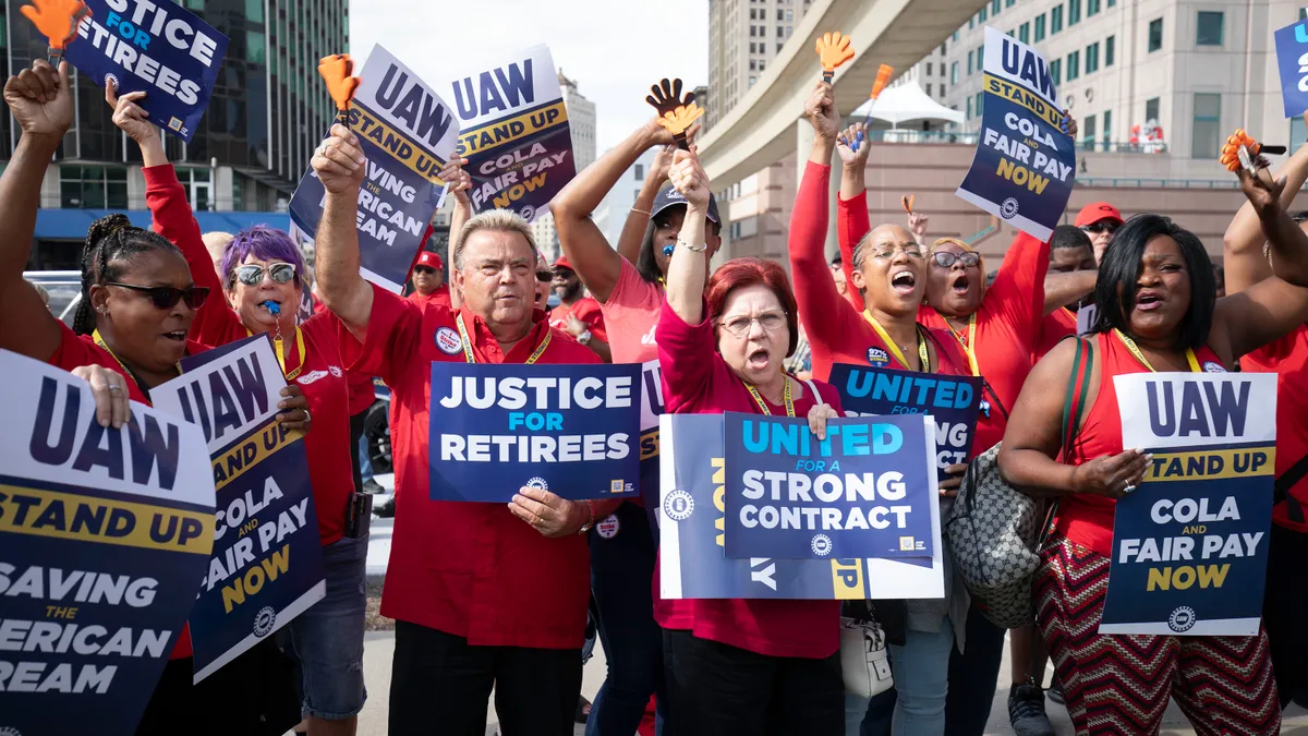 United Auto Workers members rally.