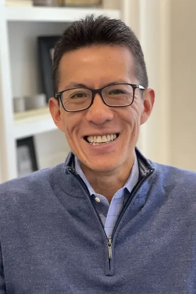 headshot of Donny Lau, CFO of Zaxby's