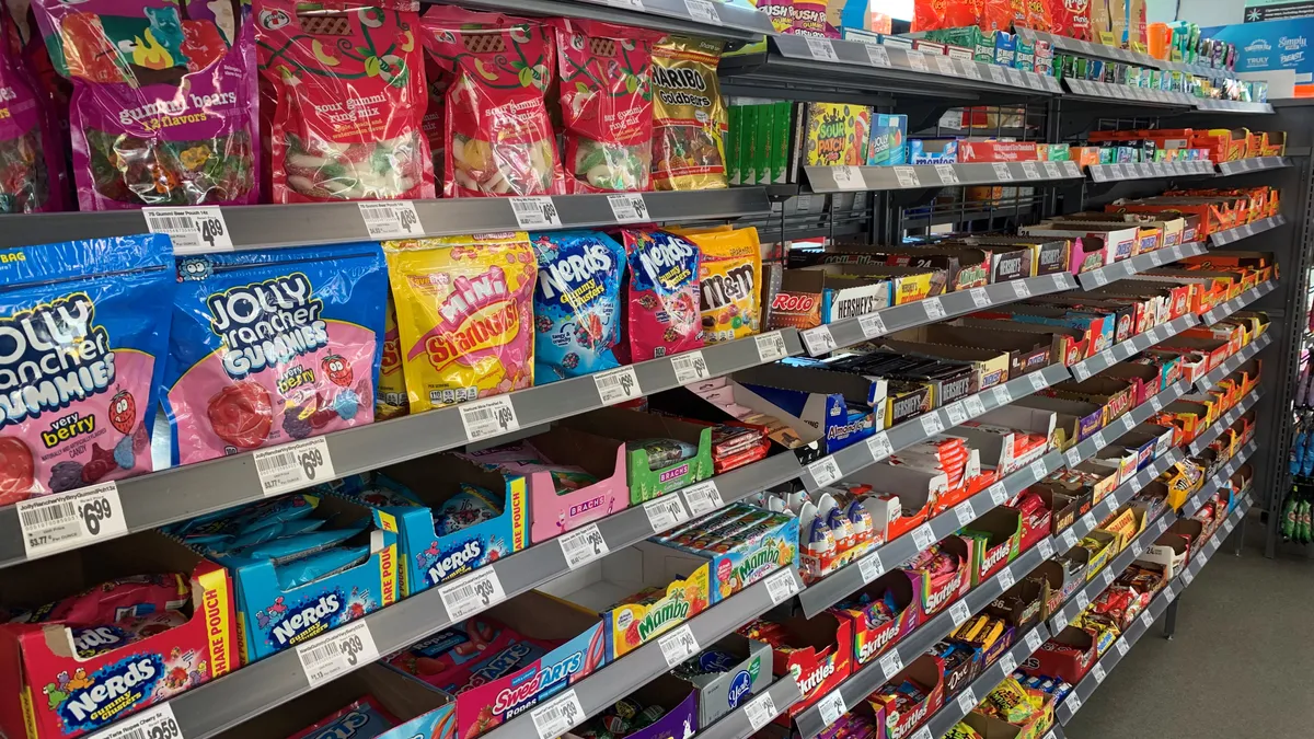 A photo of the candy aisle inside a 7-Eleven.