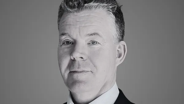 A headshot of Per Langoe, new CEO of GT Medical, wearing a suit jacket.