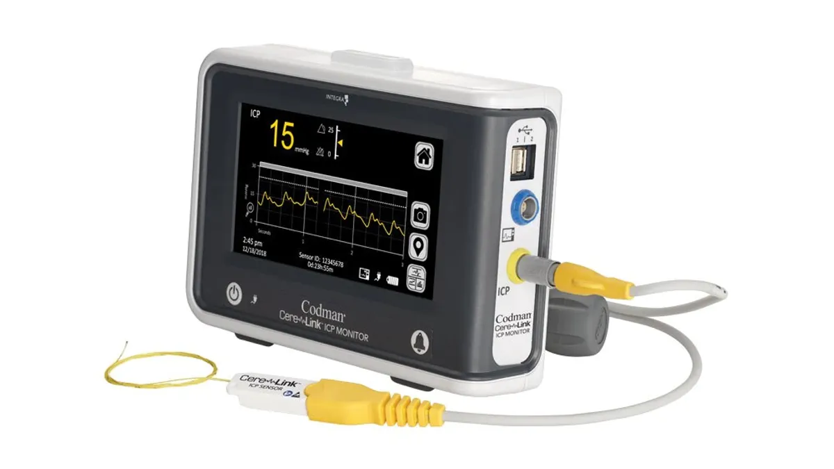 A monitor with a pressure reading in yellow, and the words "CereLink ICP Monitor" on the side.