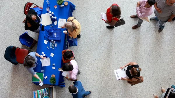 an overhead shot of jobseekers at a job fair